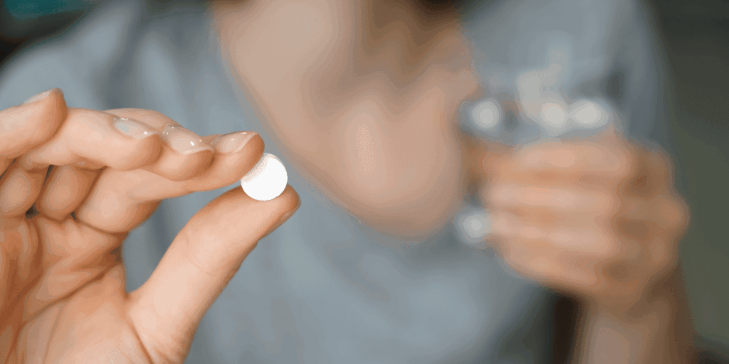 Pill_In_Womans_Hand