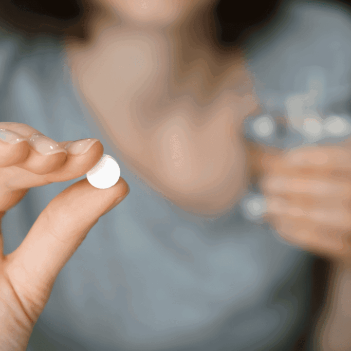 Pill_In_Womans_Hand